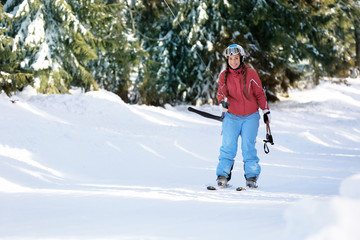 Poster - Woman using ski lift at snowy resort. Winter vacation