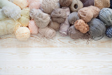 Wool And Cotton Yarn For Knitting Of Neutral Natural Color. Background Is Aged White Wood.