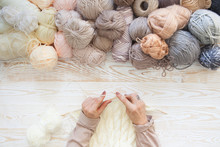 Wool And Cotton Yarn For Knitting Of Neutral Natural Color. The Woman Knits Knitting.