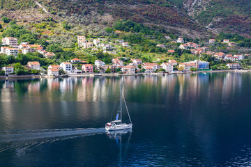 Sticker - Sailboat Motoring Past Kotor Village