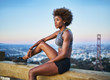 © Joshua Resnick - fit african woman woman resting on bench at runyon canyon shortly after sunset