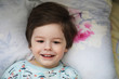 © alexkich - Portrait of a young child lying on a pillow