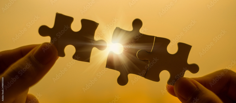 Silhouette Woman hands connecting couple puzzle piece against sunrise effect, businesswoman holding jigsaw with sunset background. Business solutions, target, success, goals and strategy concepts - obrazy, fototapety, plakaty 