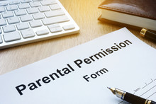 Parental Permission Form On A Wooden Table.