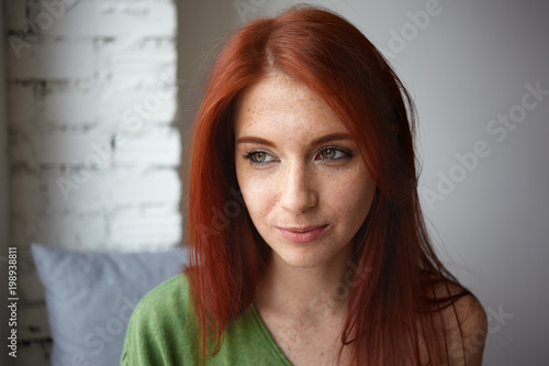 Close Up Portrait Of Dreamy Attractive Young Female With Beautiful