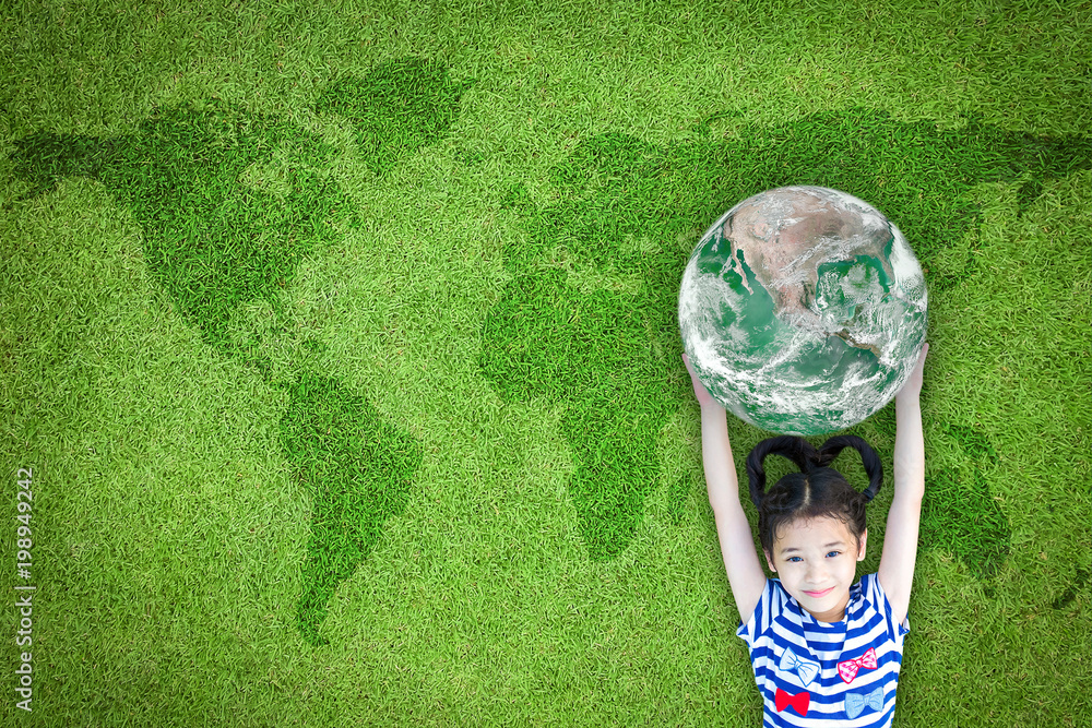Sustainable world environment and CSR with people campaign concept with girl kid raising earth on green lawn: Element of the image furnished by NASA - obrazy, fototapety, plakaty 