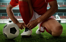 Soccer Player Tying Shoes