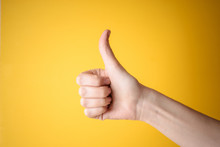Emale Hand Showing Thumbs Up Gesture