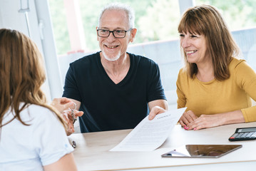 Senior couple meeting real estate agent