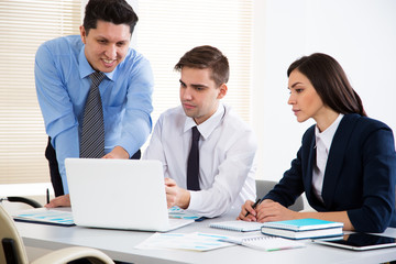 Wall Mural - Businessman tells his colleagues about a new project