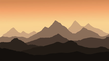 Poster - panoramic view of the mountain landscape with fog in the valley below with the alpenglow orange sky and rising sun