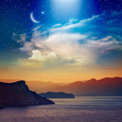 Wall Mural - ramadan kareem background with crescent, stars and glowing clouds