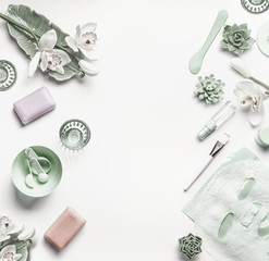 Wall Mural - green cosmetic setting for facial skin care with white orchid flowers, tools , sheet mask and access