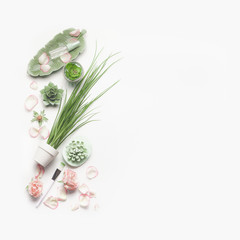 Wall Mural - green cosmetic setting for facial skin care with pink roses on white background, top view, place for