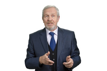 Old man in suit talking. Portrait of senior caucasian businessman in white isolated background.