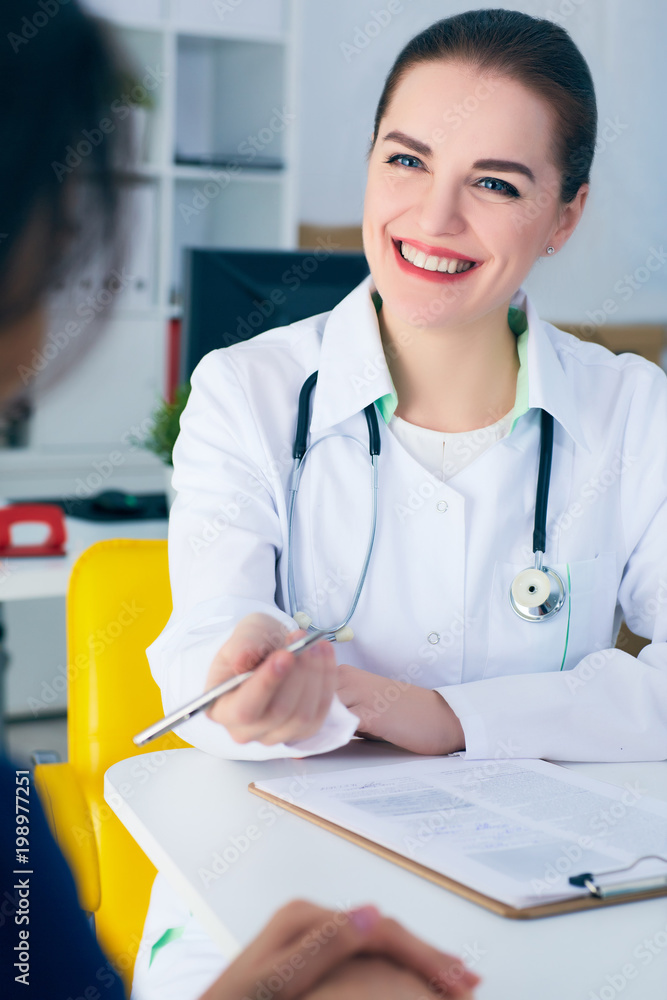 Doctor Application Images Smiling female doctor consulting patient how to fill application form ...