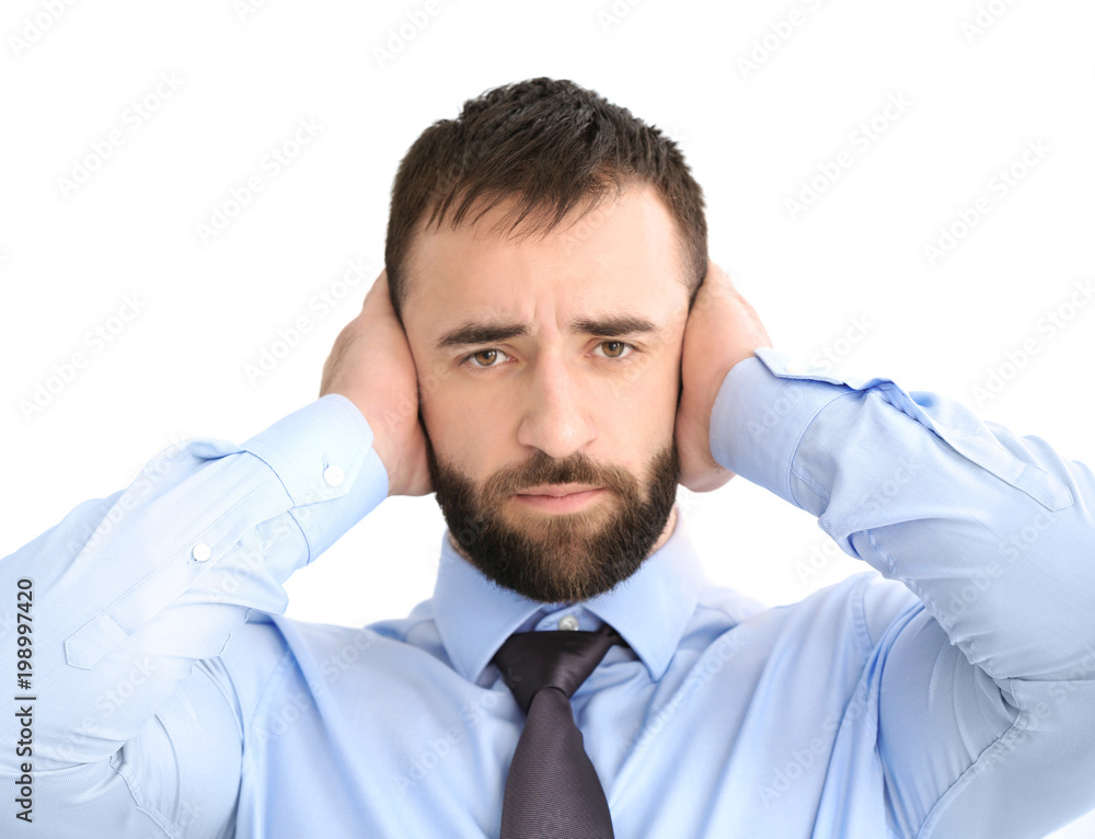 Young man with hearing problem on white background