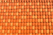 Red Orange Clay Roof Tiles In Seamless Diagonal Pattern On Sunny Day, Abstract Background Texture, Architectural Details,