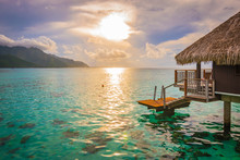 Evening With Sunset In Moorea. Overwater Bungalow On The Side With Breathtaking Lagoon, French Polynesia