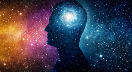Wall Mural - The universe within. Silhouette of a man inside the universe. The concept on scientific and philosophical topics.  Elements of this image furnished by NASA.
