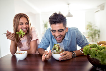 Sticker - Couple eating a salad in the kitchen