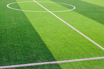 Wall Mural - The white Line marking on the artificial green grass soccer field