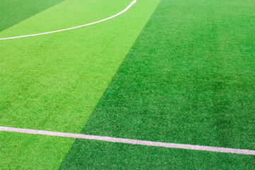 Wall Mural - The white Line marking on the artificial green grass soccer field