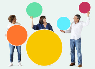 Diverse people holding colorful blank circles