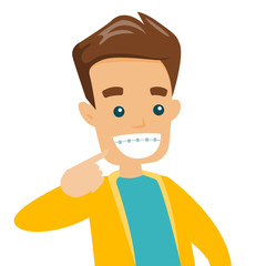 Poster - Young happy caucasian white man smiling with braces on teeth. Cheerful man showing his smile with dental braces. Vector cartoon illustration isolated on white background. Square layout.