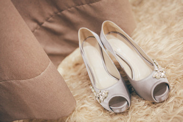 Wall Mural - Bride wedding details - wedding shoes. Selective focus. Toned image. Copy space.