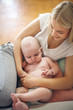 © Mladen - Mother holding baby boy in embracing.