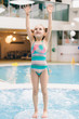 © Photocreo Bednarek - Little girl standing on the floor in a pool