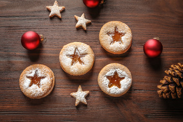 Wall Mural - Tasty Linzer cookies with jam and Christmas decorations on table