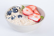 © ddukang - Oatmeal, Milk. A bowl of oatmeal with fresh strawberries, healthy breakfast with a cup of milk.