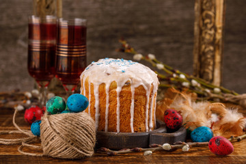 Christian holidays photos of Easter food in a rustic style. The table is covered with Easter cakes and painted eggs.