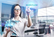 © photon_photo - The concept of business, technology, the Internet and the network. A young entrepreneur working on a virtual screen of the future and sees the inscription: Workflow