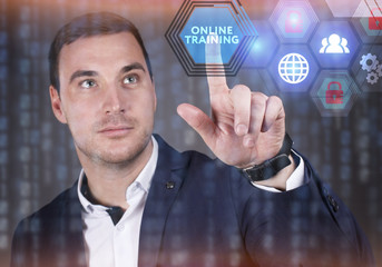 Business, Technology, Internet and network concept. Young businessman working on a virtual screen of the future and sees the inscription: Online training