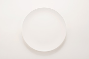 Wall Mural - White plate on white background
