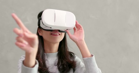 Wall Mural - Woman playing game with VR device