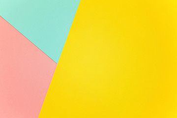 Blue, yellow and pink pastel color paper geometric flat lay background