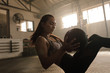 © Jacob Lund - Woman exercising with medicine ball at gym