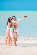 Family Taking A Selfie Photo On The Beach. Family Beach Vacation