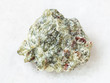 raw olivine stone on white