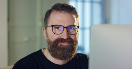 Portrait of a handsome man with the beard that smiles. Concept: Happiness, good life, work