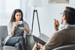 © LIGHTFIELD STUDIOS - Woman drinking coffee and listening to male doctor recommendations