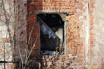 old brick ruins that remained from the historic house. empty window.