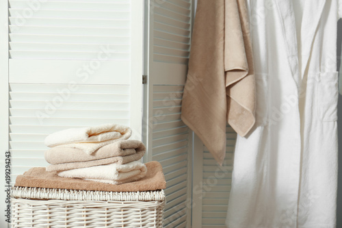 Stack Of Clean Towels On Laundry Basket In Bathroom Stack Of Clean Towels On Laundry Basket In Bathroom