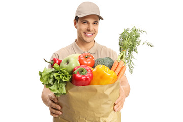 Wall Mural - Delivery guy giving a bag of groceries