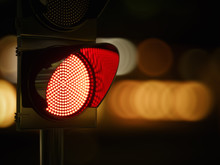 Red Traffic Light In The Dark Night City Street