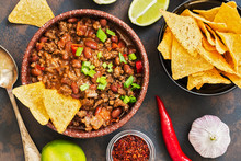 Mexican Food Dish Chili Con Carne. The Concept Of Mexican Cuisine. Top View, Old, Rusty Background.